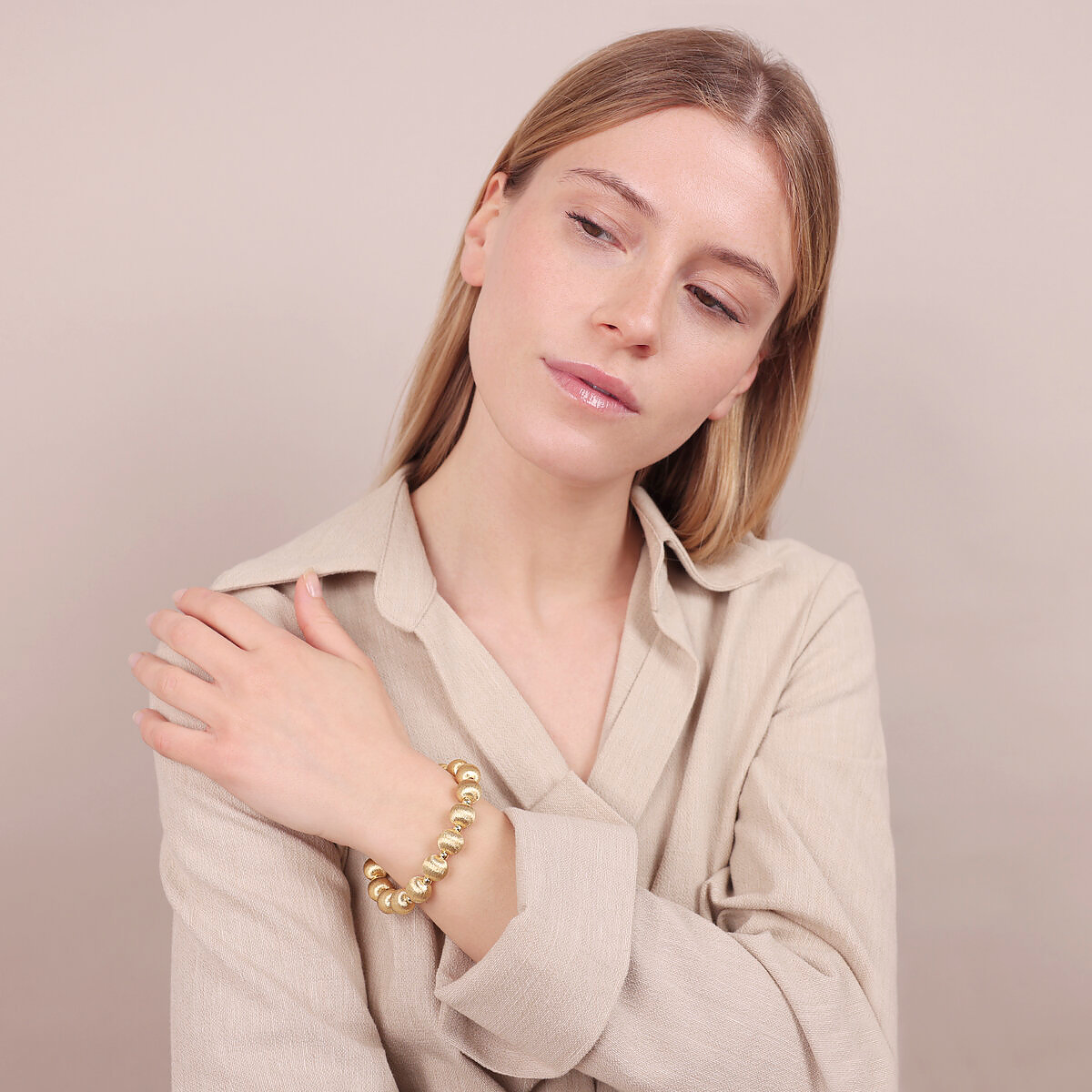 Bracelet in 925 silver 18kt yellow gold plated with satin-finished maxi beads and small polished spheres.